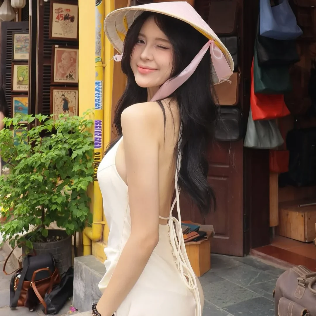 Photo 6 of Váy lụa cổ yếm hở lưng