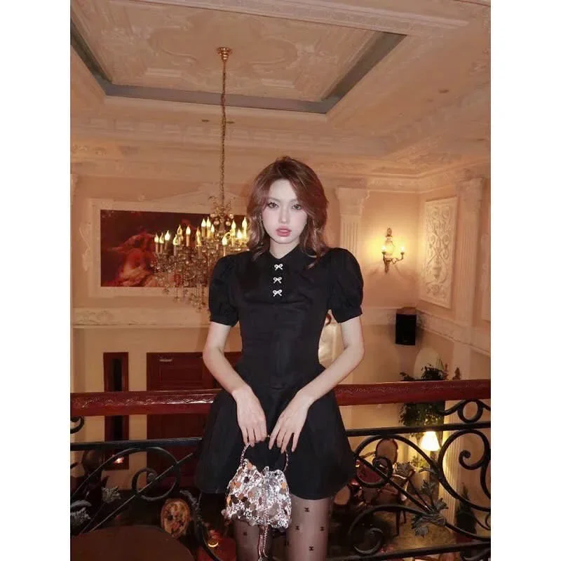 Ảnh 4 của Váy mini đen tay phồng nơ trắng nữ