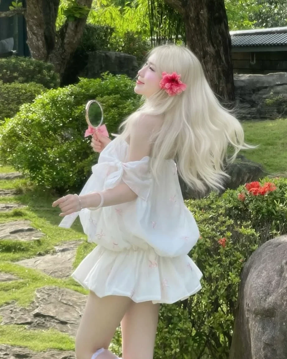 Photo 2 of Váy babydoll trắng nơ hồng nữ