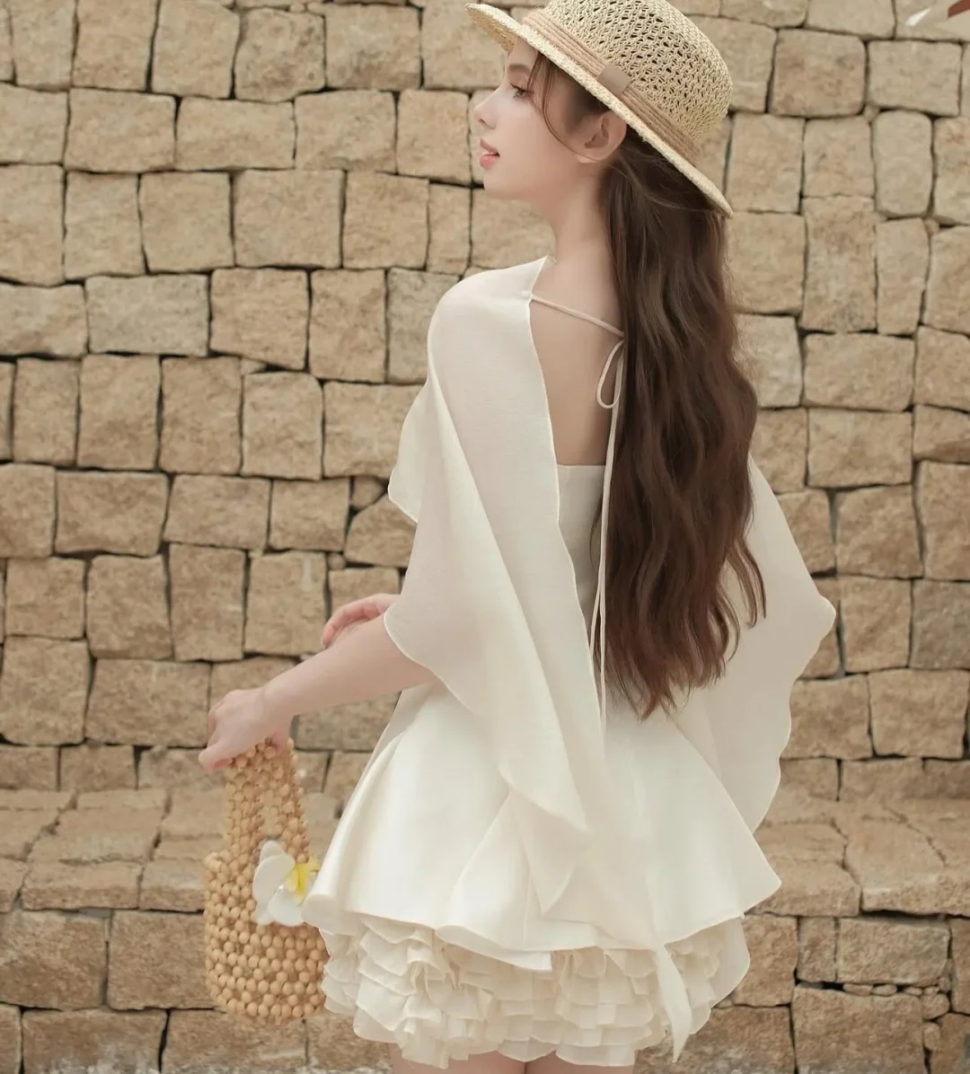 Ảnh 6 của Váy mini cape trắng lụa nữ
