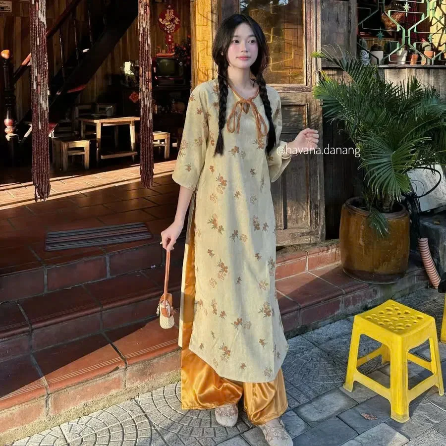 Photo 1 of Áo dài hoa nhí vàng nhạt nữ