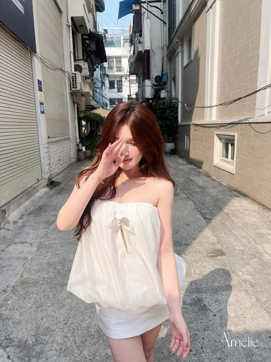 Photo 1 of Áo trễ vai trắng nơ kèm chân váy ngắn