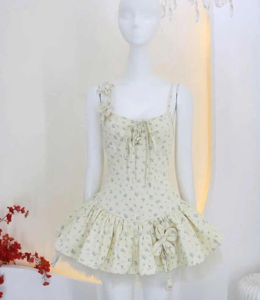 Photo 5 of Váy hai dây hoa nhí xếp bèo kem nữ