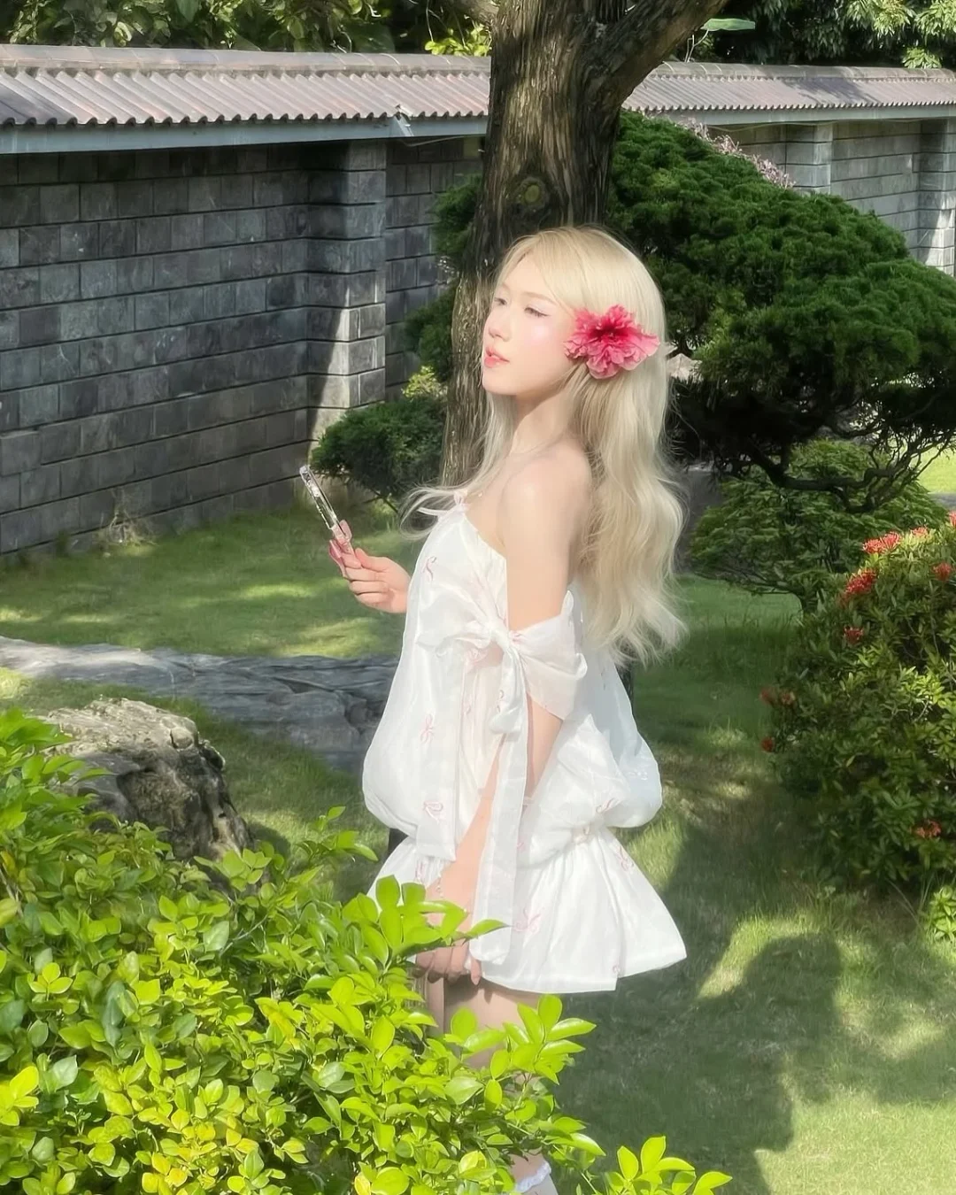 Photo 6 of Váy babydoll trắng nơ hồng nữ