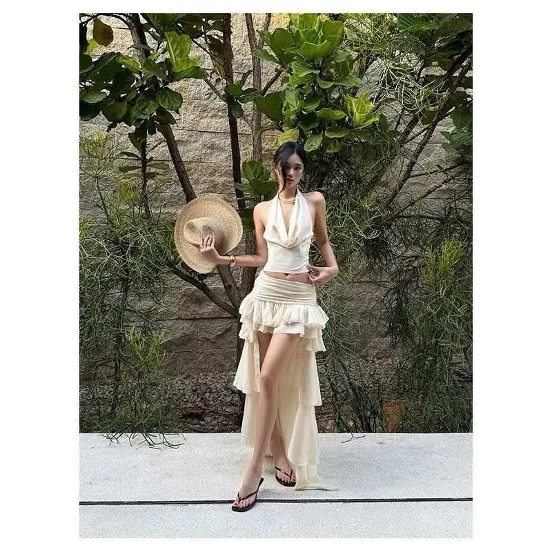 Ảnh 2 của Đầm maxi trắng lụa halter xẻ tà