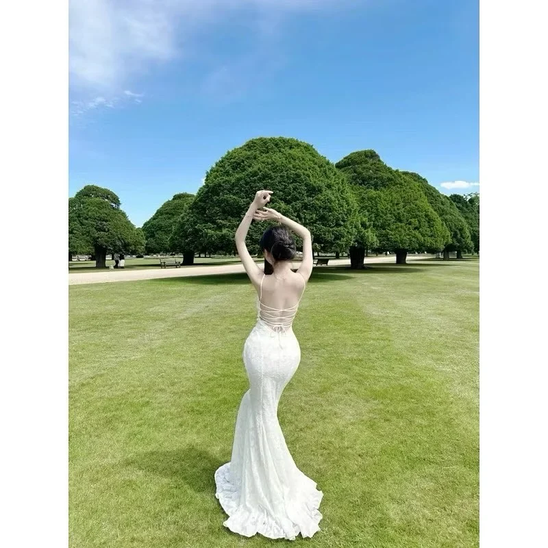 Photo 4 of Váy maxi trắng cột dây lưng nữ