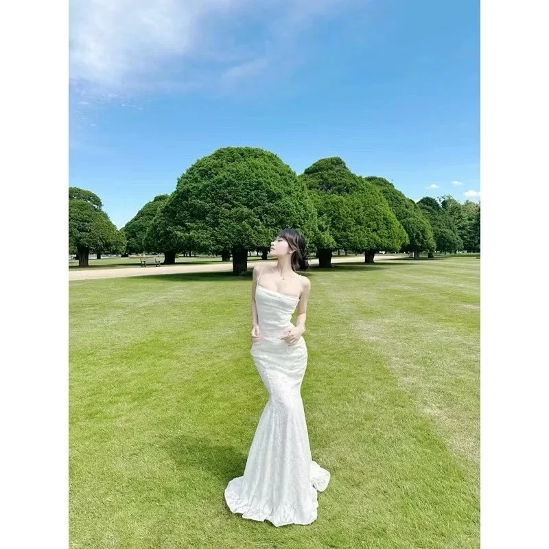 Photo 3 of Váy maxi trắng cột dây lưng nữ