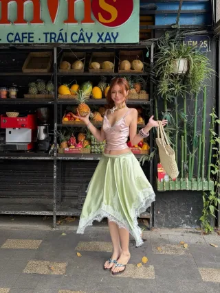 Photo 4 of Set crop top lụa hồng và chân váy midi xanh mint