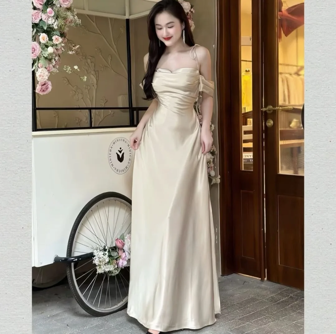 Photo 1 of Đầm maxi satin kem trễ vai nữ
