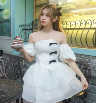 Photo 3 of Váy trắng trễ vai nơ đen size M