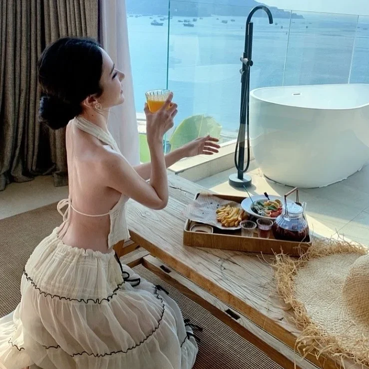 Photo 6 of Set Croptop Yếm Và Váy Maxi Voan Kem Nữ