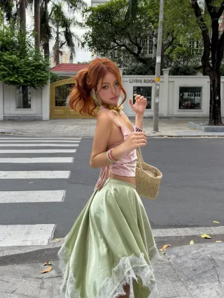 Photo 2 of Set crop top lụa hồng và chân váy midi xanh mint