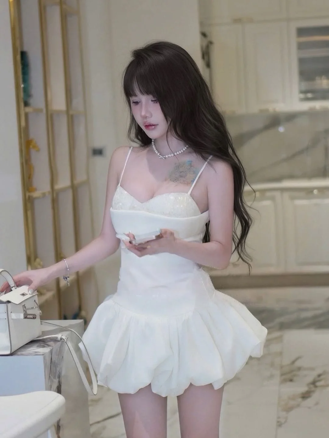 Photo 1 of Đầm trắng ngắn hai dây babydoll nữ