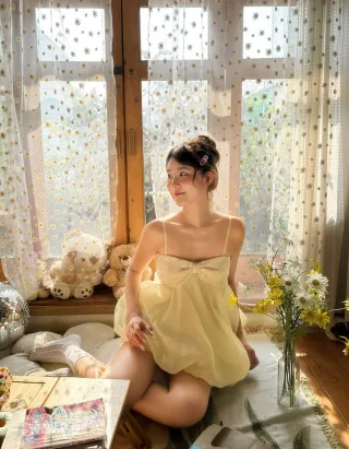 Photo 2 of Đầm babydoll voan vàng nhạt nữ tính