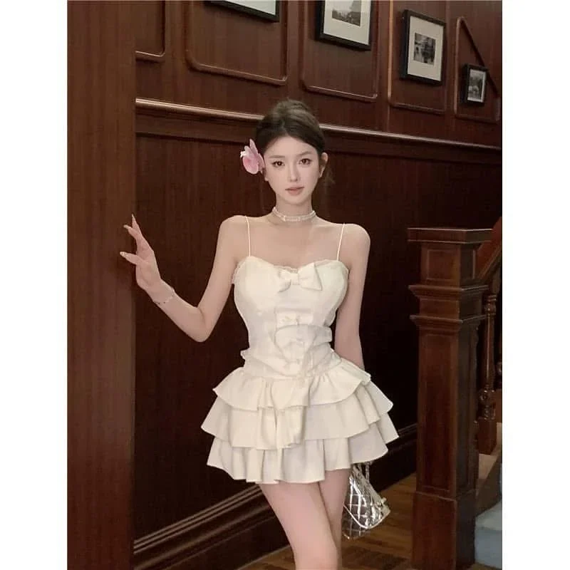 Photo 2 of Đầm mini trắng hai dây bèo nhún nữ