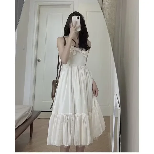 Photo 1 of Váy maxi trắng nơ ngực nữ tính
