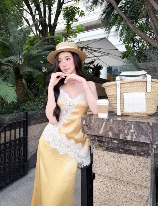 Photo 2 of Váy lụa vàng ren hai dây nữ