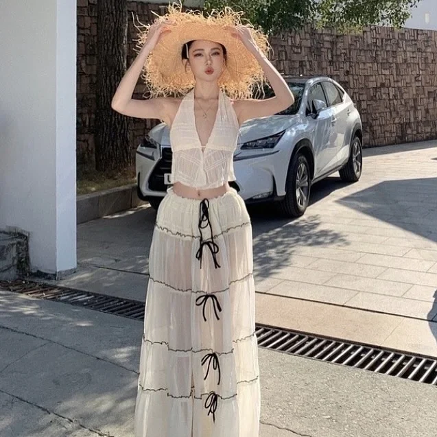 Photo 4 of Set Croptop Yếm Và Váy Maxi Voan Kem Nữ