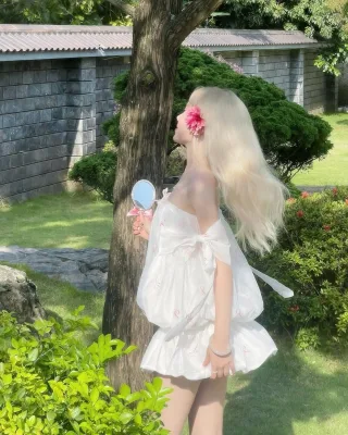Photo 3 of Váy babydoll trắng nơ hồng nữ