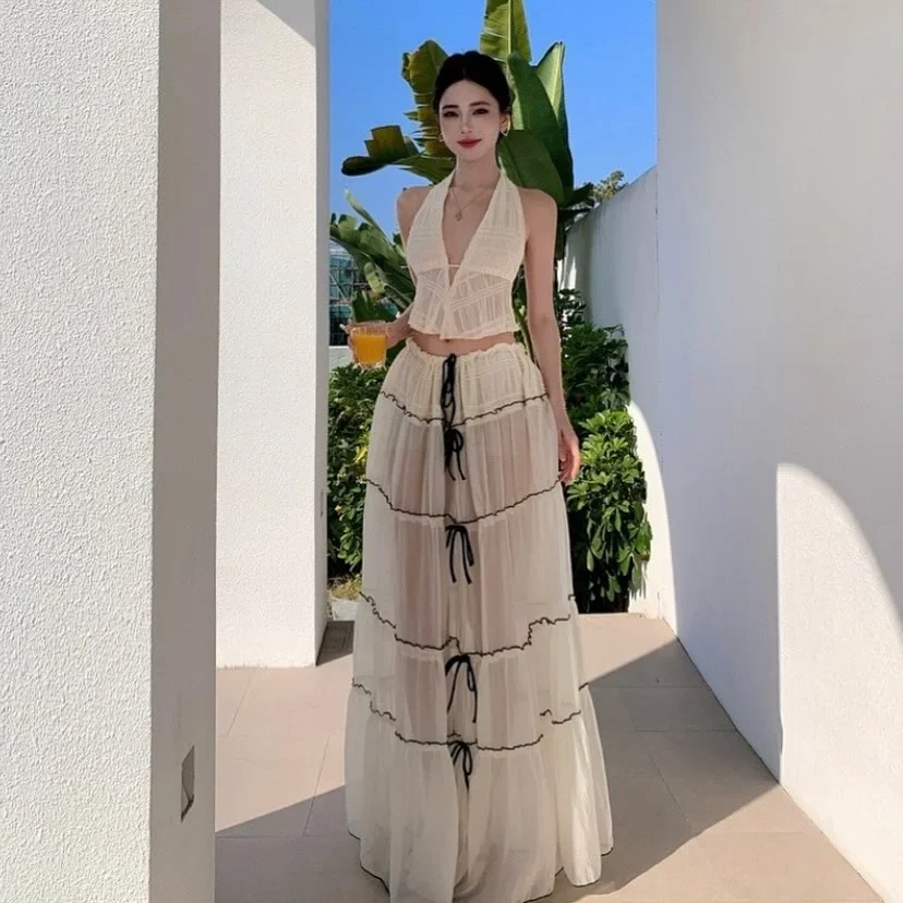 Photo 1 of Set Croptop Yếm Và Váy Maxi Voan Kem Nữ
