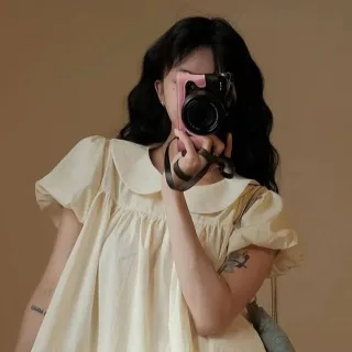 Photo 1 of Váy babydoll vàng nhạt cổ sen nữ