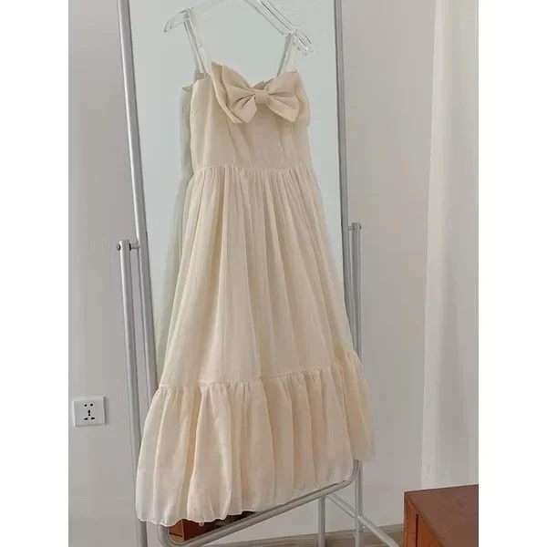 Photo 3 of Váy maxi trắng nơ ngực nữ tính