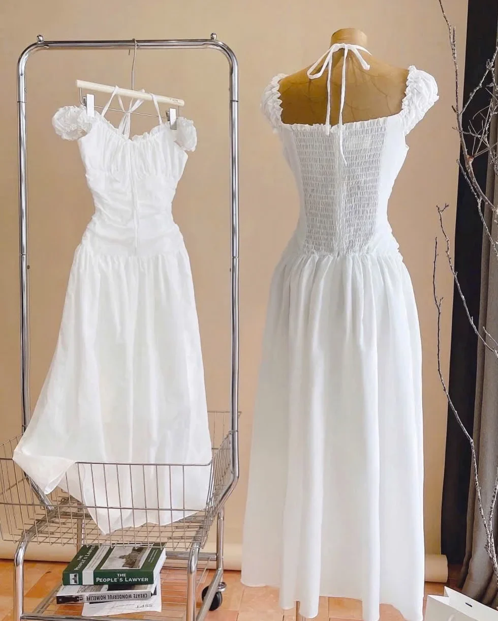Photo 8 of Váy maxi trắng trễ vai cột dây nữ