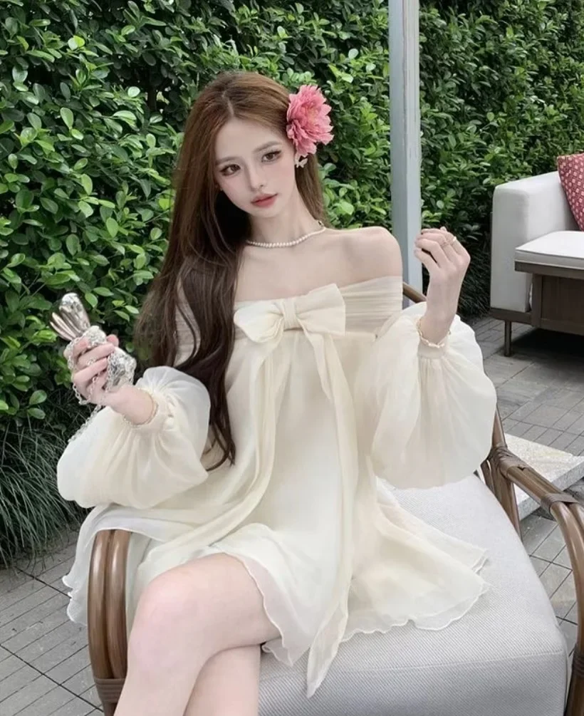 Ảnh 3 của Đầm trễ vai voan kem nơ to nữ