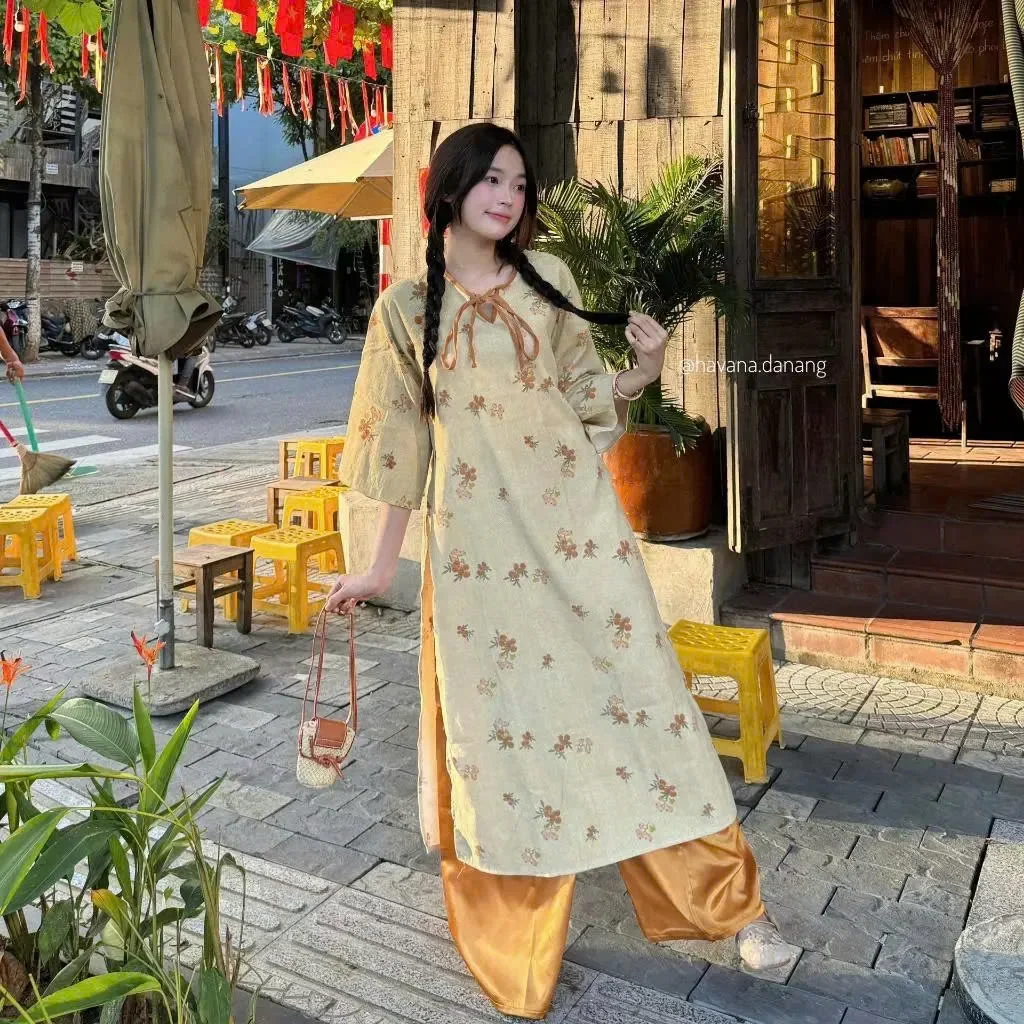 Photo 2 of Áo dài hoa nhí vàng nhạt nữ