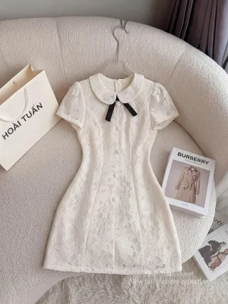 Photo 1 of Váy ren trắng cổ sen nơ đen nữ
