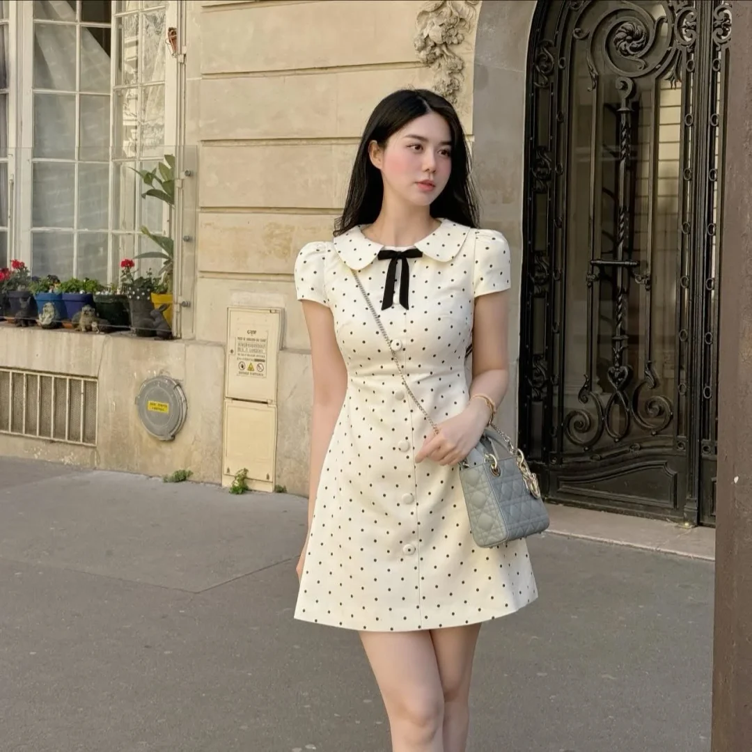 Photo 7 of Váy chấm bi trắng cổ búp bê nữ