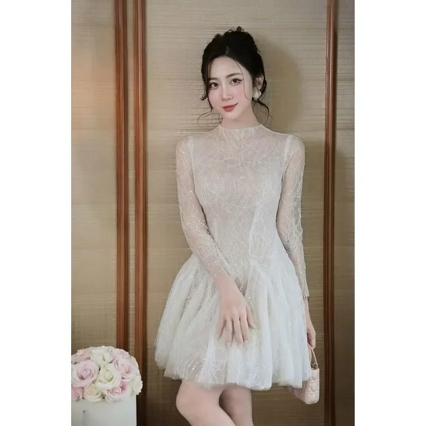 Photo 2 of Váy ren trắng tay dài Khâu Design