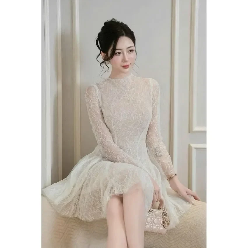 Photo 3 of Váy ren trắng tay dài Khâu Design