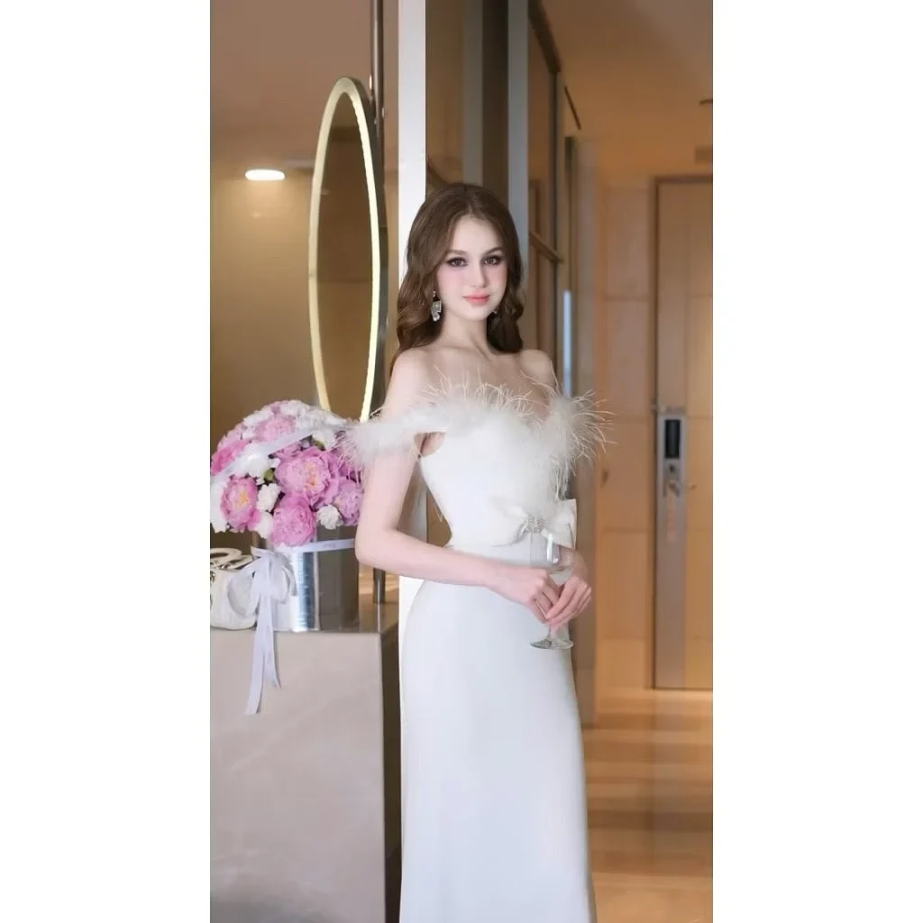 Ảnh 4 của Đầm dạ hội trắng vai bồng lông vũ