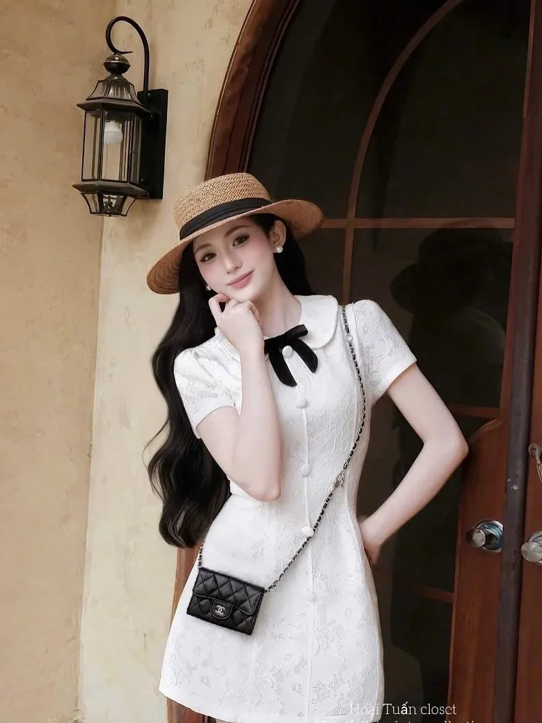 Ảnh 2 của Váy mini trắng nơ đen nữ