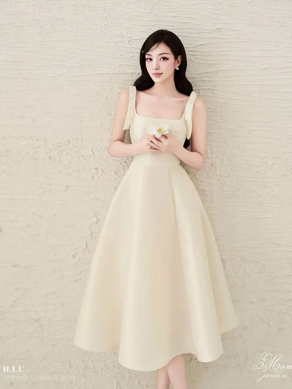 Ảnh 2 của Đầm hai dây nơ vai kem H.I.U fashion