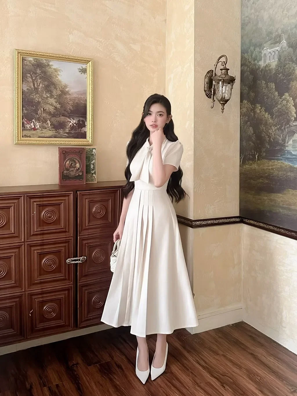Photo 2 of Váy midi kem nơ cổ Elysnie size S