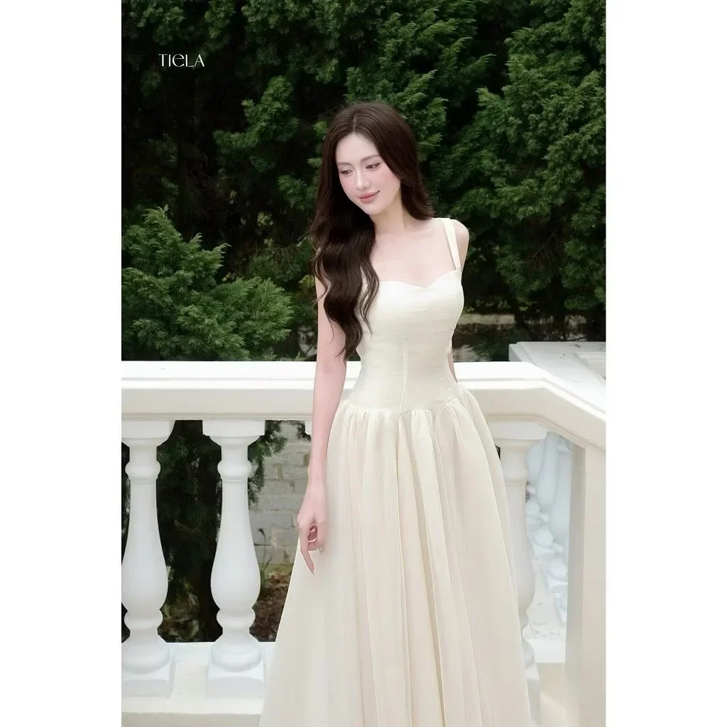 Photo 2 of Đầm maxi voan hai dây màu kem Tiela