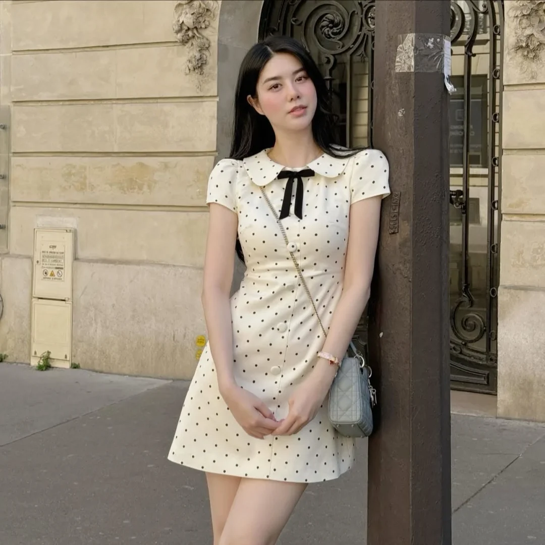 Photo 6 of Váy chấm bi trắng cổ búp bê nữ