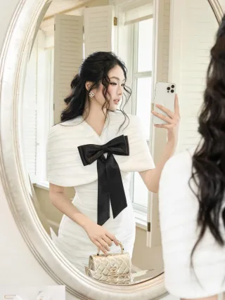 Ảnh 1 của Đầm trắng nơ đen dự tiệc size M