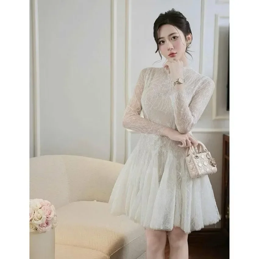 Photo 1 of Váy ren trắng tay dài Khâu Design