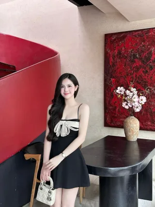 Photo 1 of Váy ngắn đen nơ trắng Aguja Studio
