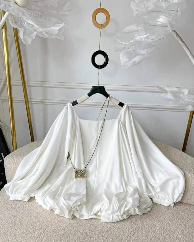 Photo 1 of Áo blouse lụa trắng trễ vai tay phồng nữ