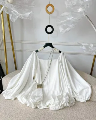 Photo 1 of Áo blouse lụa trắng trễ vai tay phồng nữ