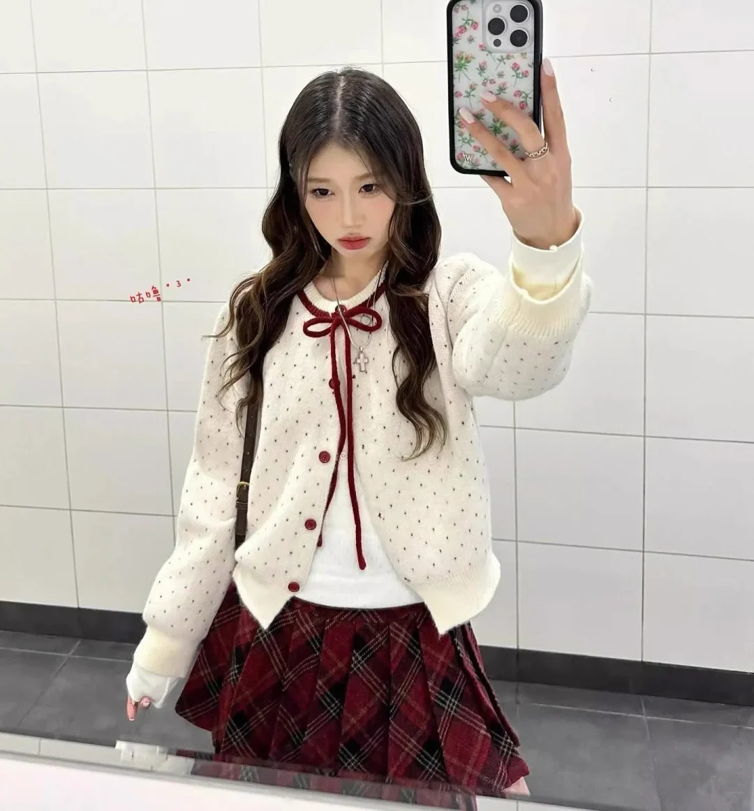 Photo 1 of Set áo cardigan len chấm bi và chân váy caro nữ