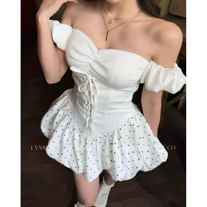 Photo 2 of Bộ corset trắng trễ vai chân váy chấm bi nữ