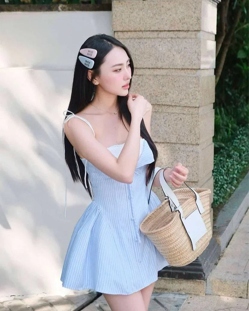 Photo 1 of Đầm ngắn sọc xanh nhạt hai dây nơ vai