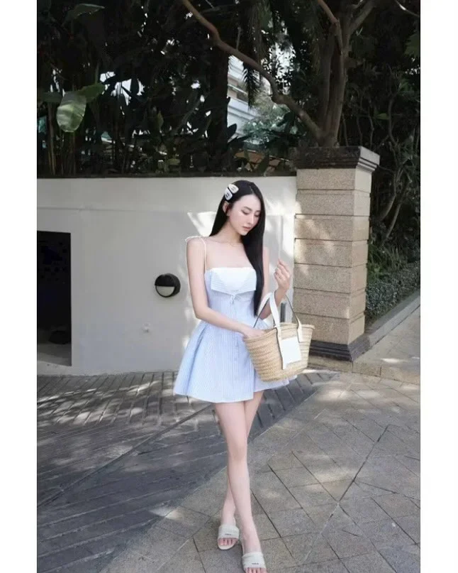 Photo 2 of Đầm ngắn sọc xanh nhạt hai dây nơ vai