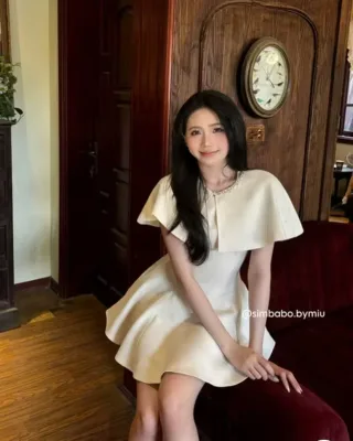 Photo 4 of Đầm satin kem tay cánh dơi nữ