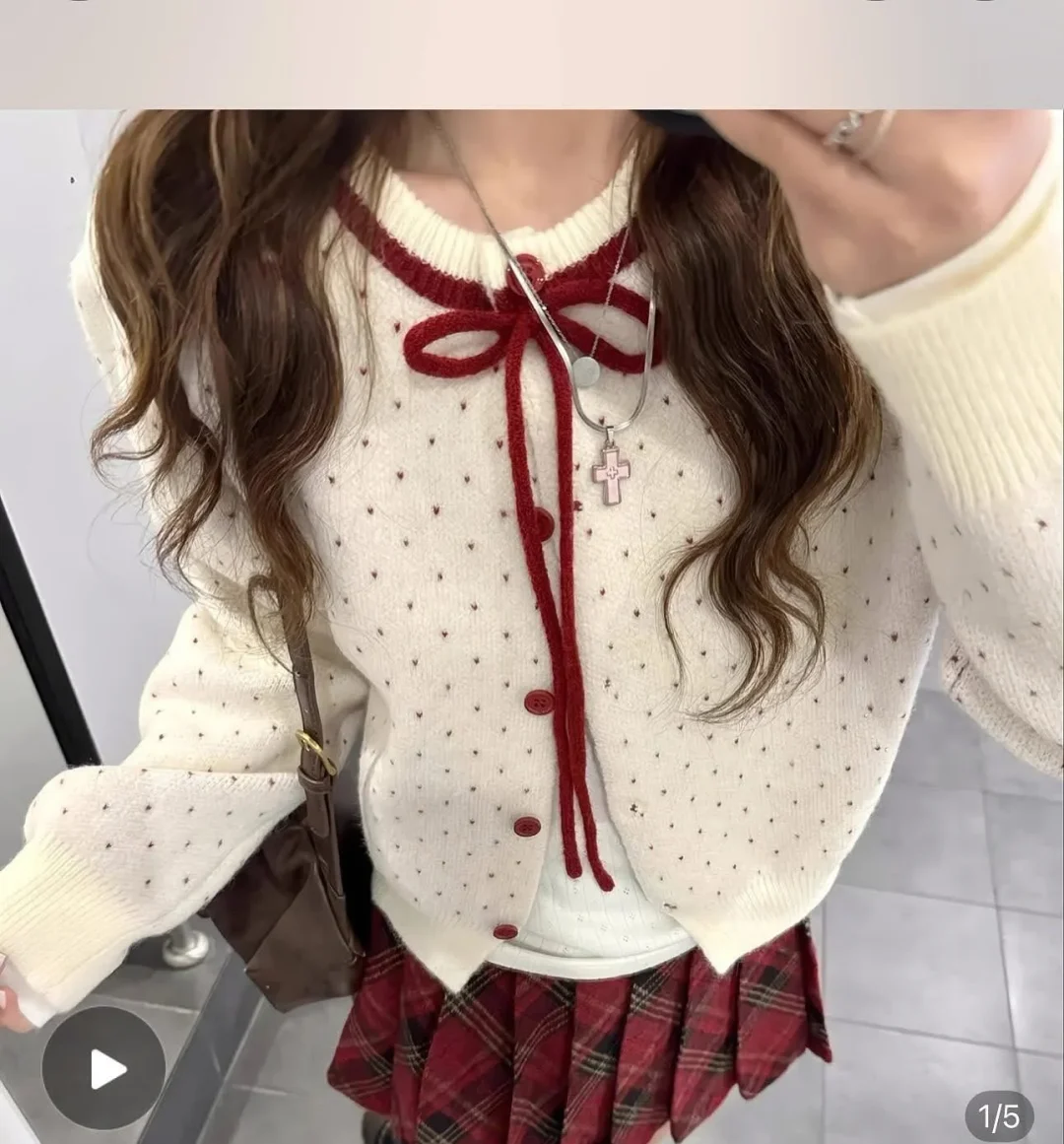 Photo 4 of Set áo cardigan len chấm bi và chân váy caro nữ